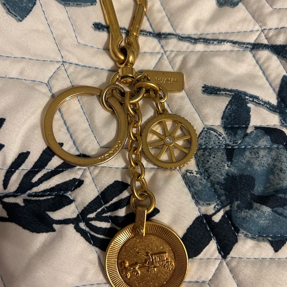 Coach Gold Keychain with Wheel and Coin Charms